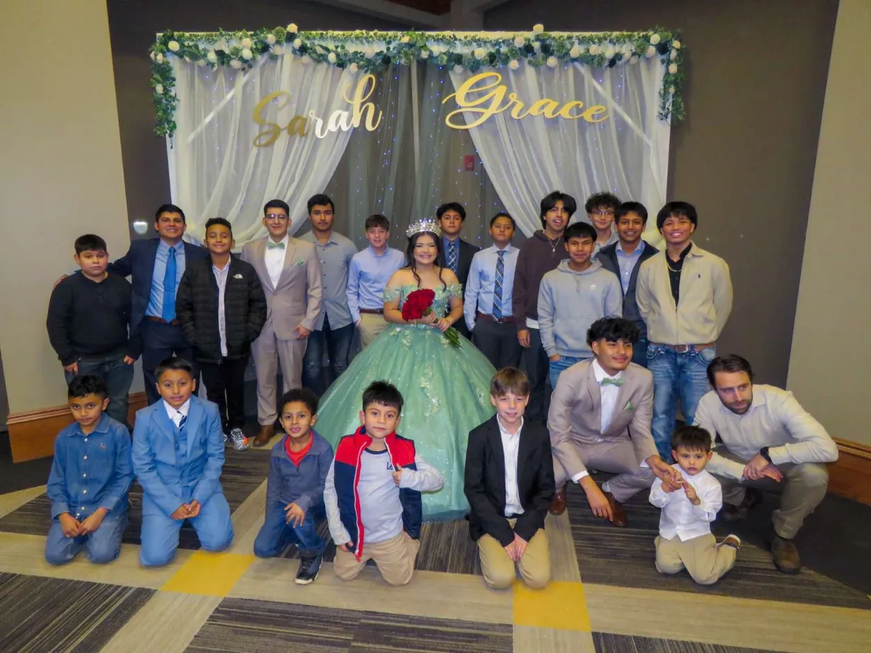Church family gathered for a quinceañera celebration